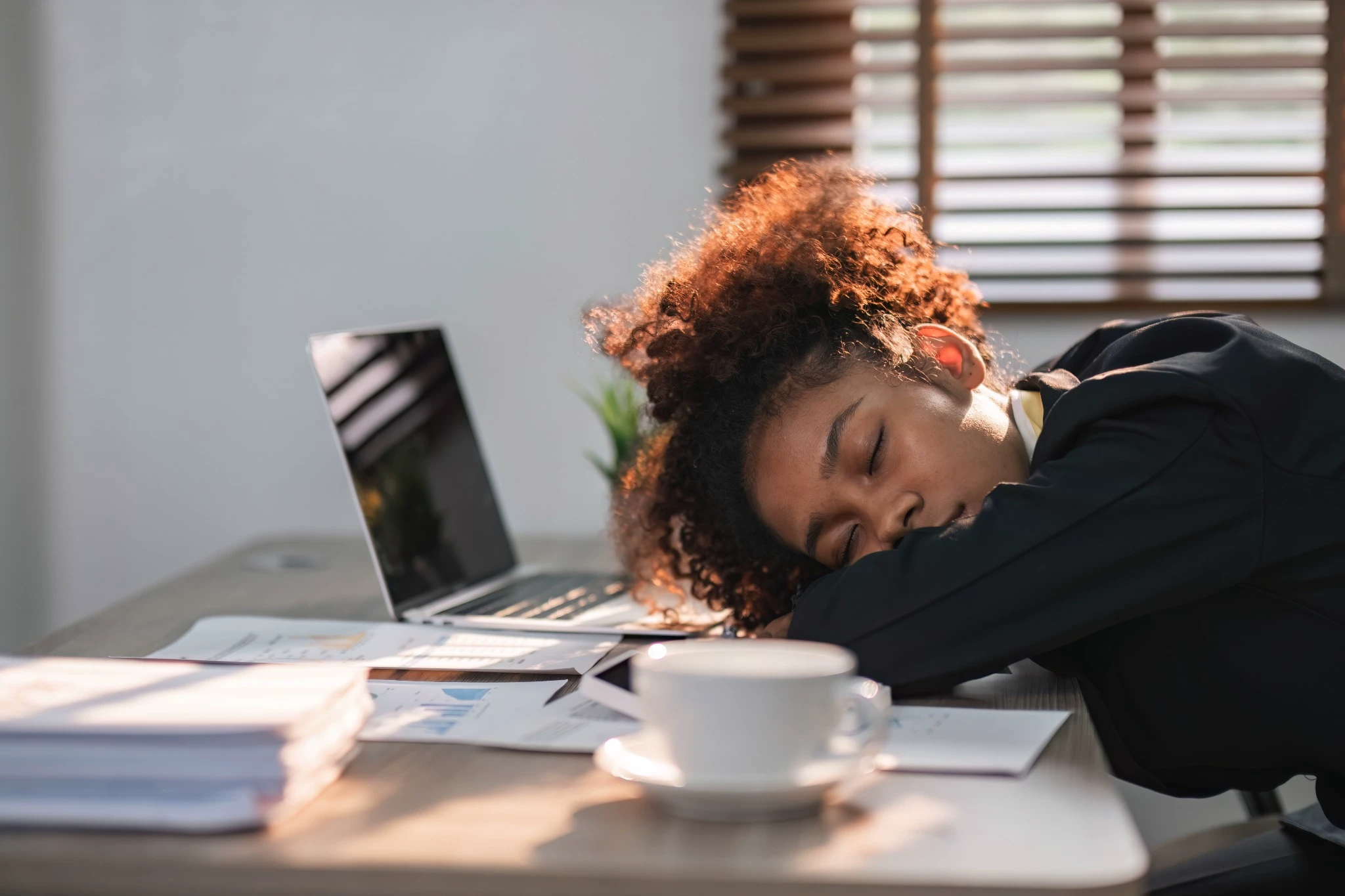 HR leaders discussing presenteeism in the workplace and proactive employee wellbeing